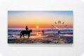 Panorama-Uhr Dibond - Pferde am Strand